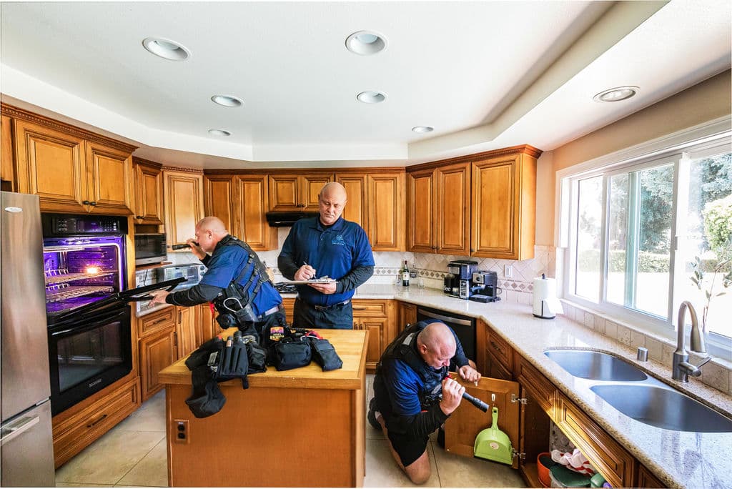 The Trident Inspection Group team during a home inspection